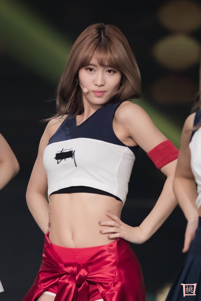 TWICE members in eye-catching, coordinated outfits, captivating the audience at their 2025 dome tour.