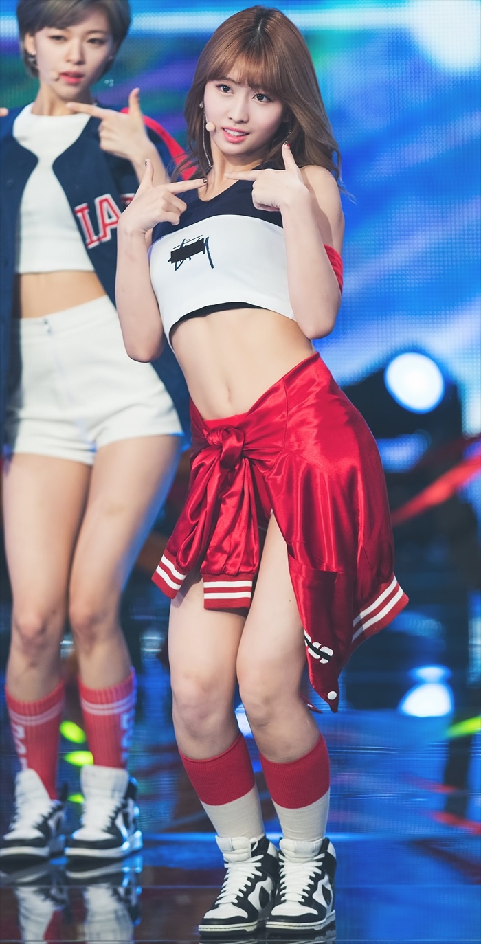TWICE performing with confidence in sleek, modern costumes during their 2025 live show.
