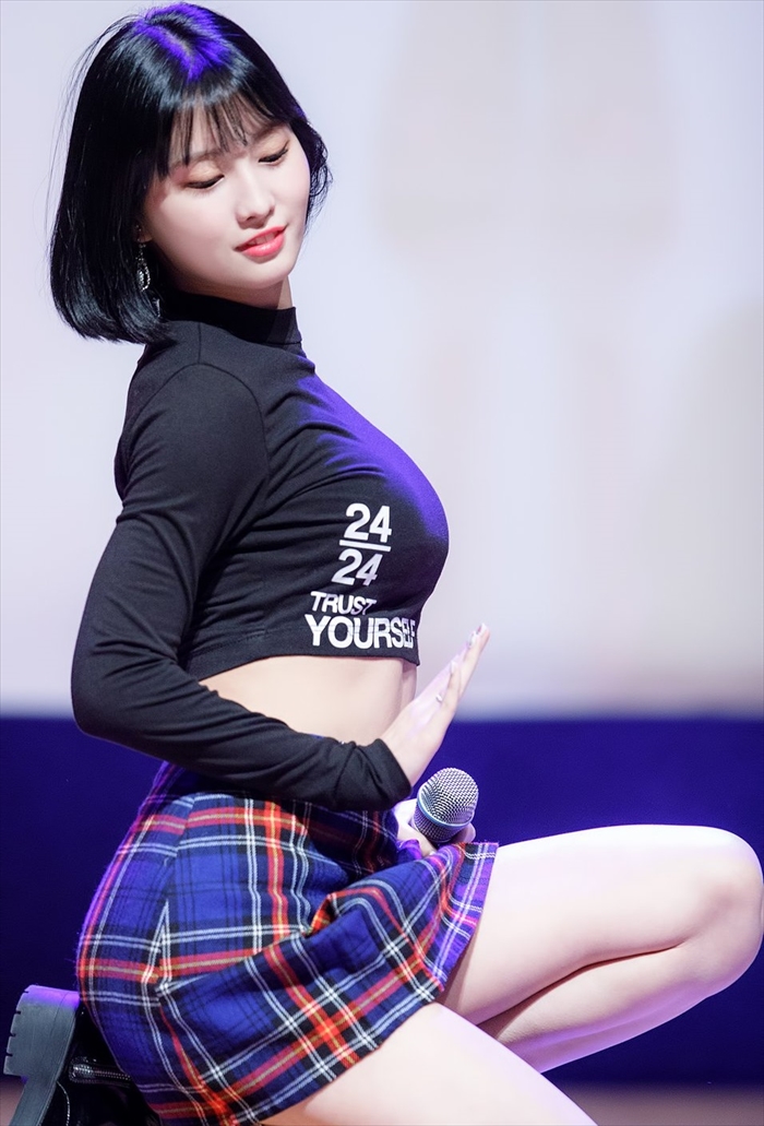 TWICE showcasing their charm in vibrant, stylish costumes during their 2025 dome tour.